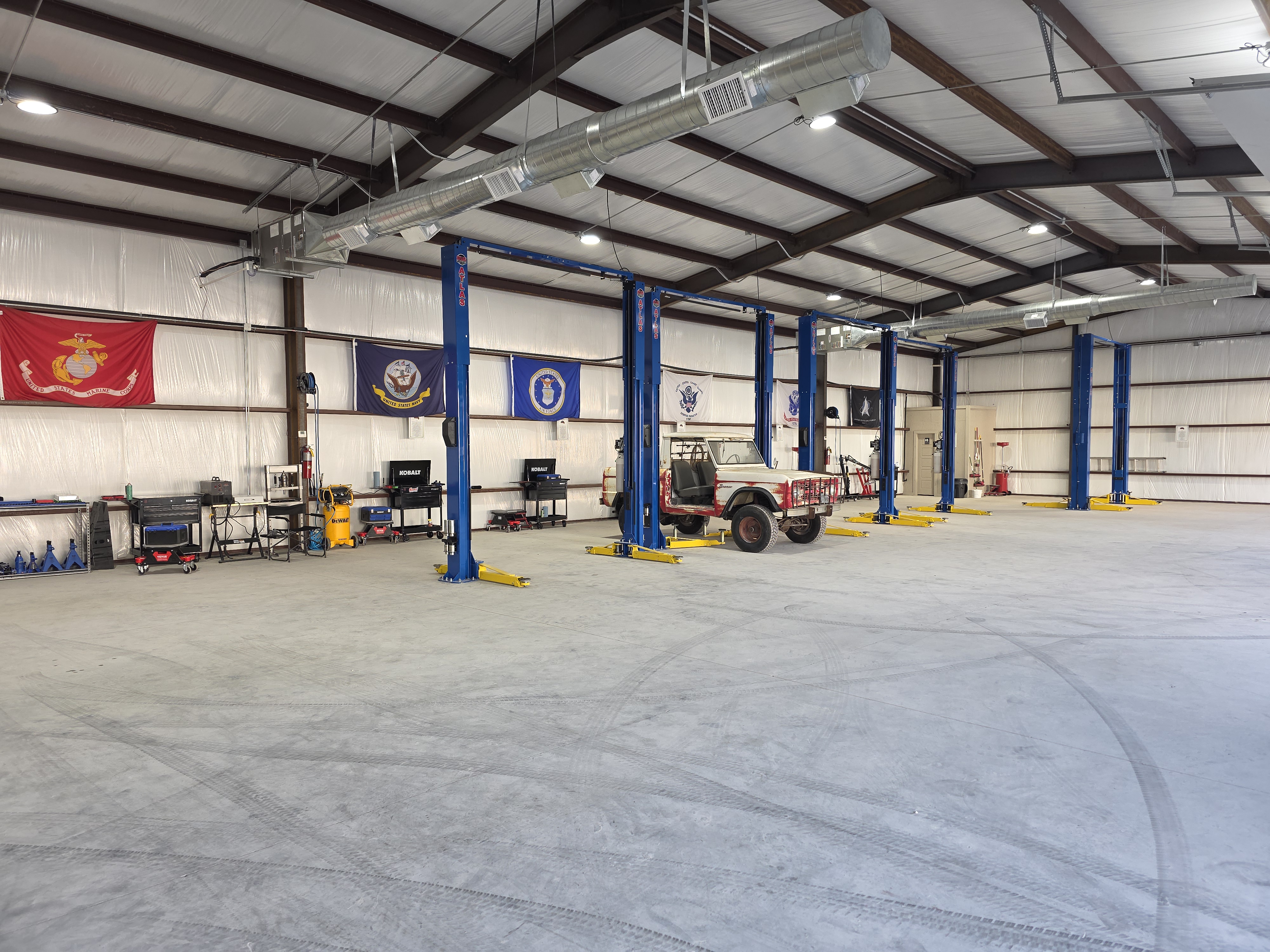 OGC10 Garage Interior with Lift Bays and Military Flags
